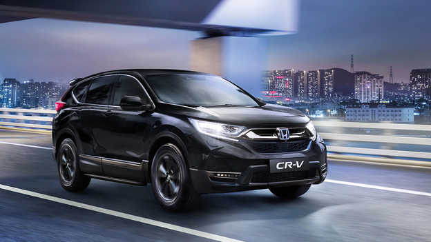 My Honda+-appen på telefon i hånden